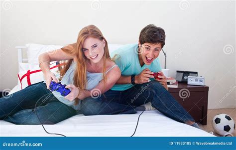 boy and girl playing video games|guy playing video games.